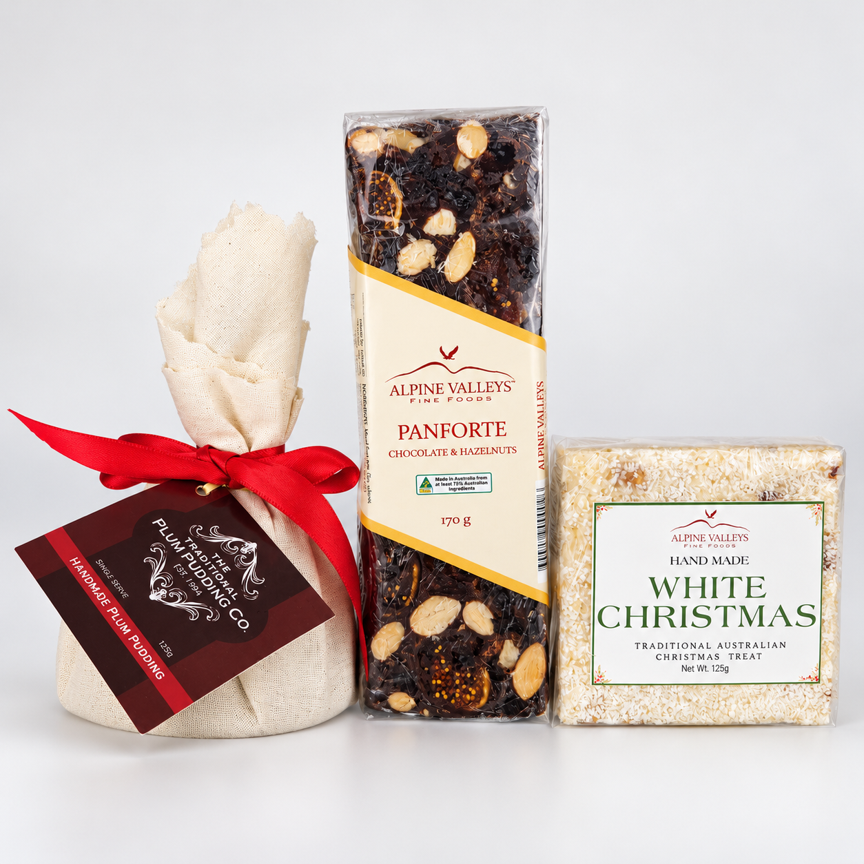 Australian Christmas Sampler by Alpine Valleys Fine Foods featuring Traditional Plum Pudding 125g, Chocolate Hazelnut Panforte 170g and White Christmas 125g.