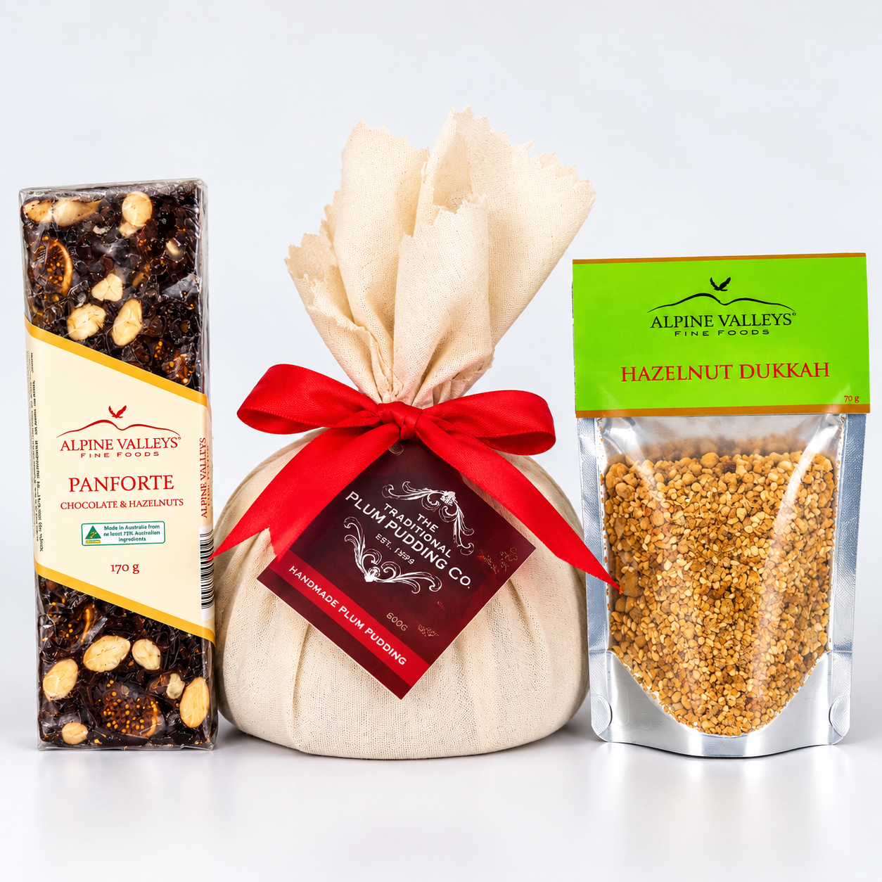Alpine Valleys Fine Foods Christmas Entertainer Selection featuring Traditional Plum Pudding 600g, Chocolate Hazelnut Panforte 170g and Hazelnut Dukkah 70g.