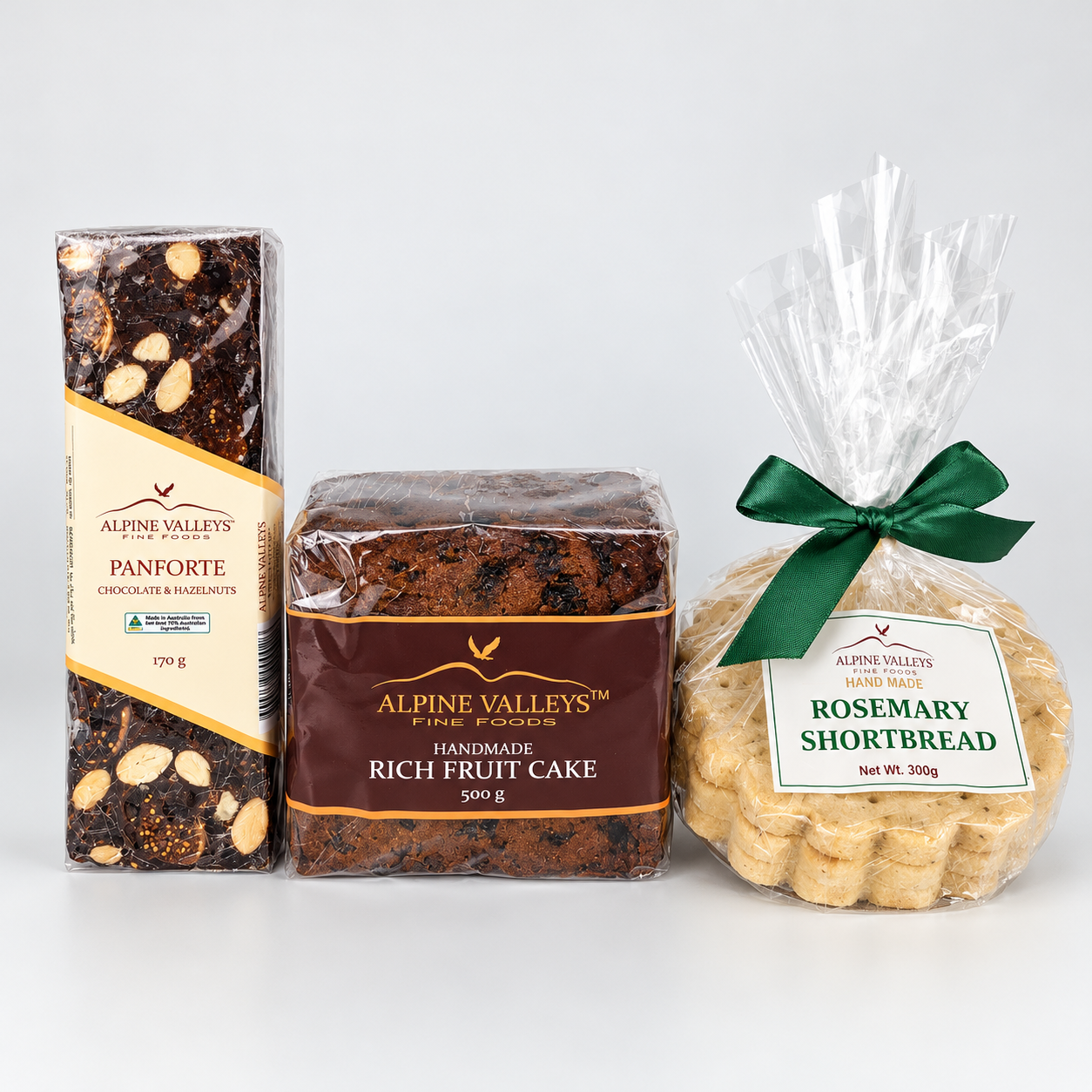Festive Gourmet Trio by Alpine Valleys Fine Foods featuring Chocolate Hazelnut Panforte 170g, Handmade Rich Fruit Cake 500g and Rosemary Shortbread 300g.