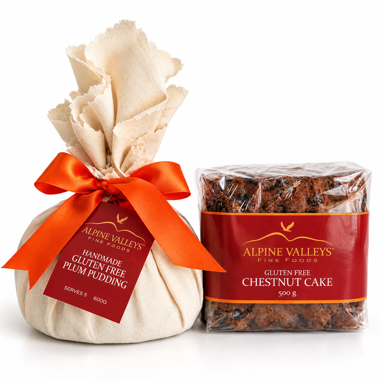 Close-up of Alpine Valleys Fine Foods Gluten-Free Christmas Duo featuring handmade Plum Pudding 600g wrapped in calico with orange ribbon and Chestnut Cake 500g.