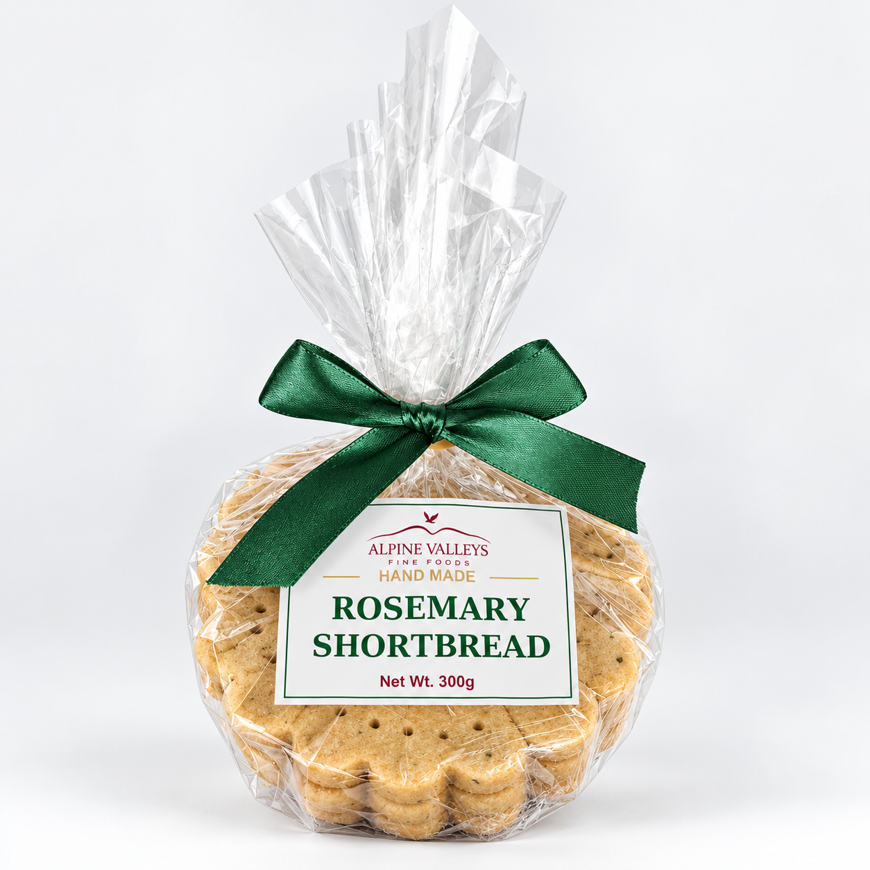 Alpine Valleys Fine Foods Handmade Rosemary Shortbread 300g, golden artisan biscuits in clear gift packaging with a forest green ribbon and branded label.