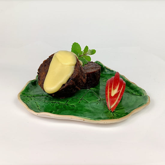 Traditional Christmas Plum Pudding Roll 1 kg – sliced log showing rich fruit, brandy and spices, handmade and easy to portion for catering.